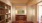 a room with a bookcase and a chair